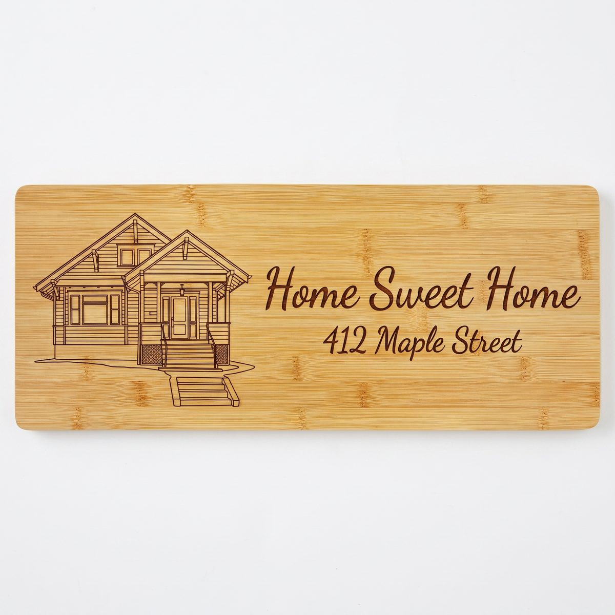 Long charcuterie board engraved with the home and address